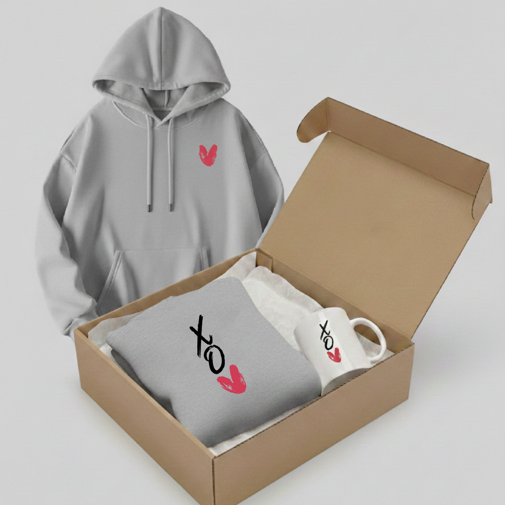 Gray hoodie with red and black designs in an open cardboard box on a light gray background