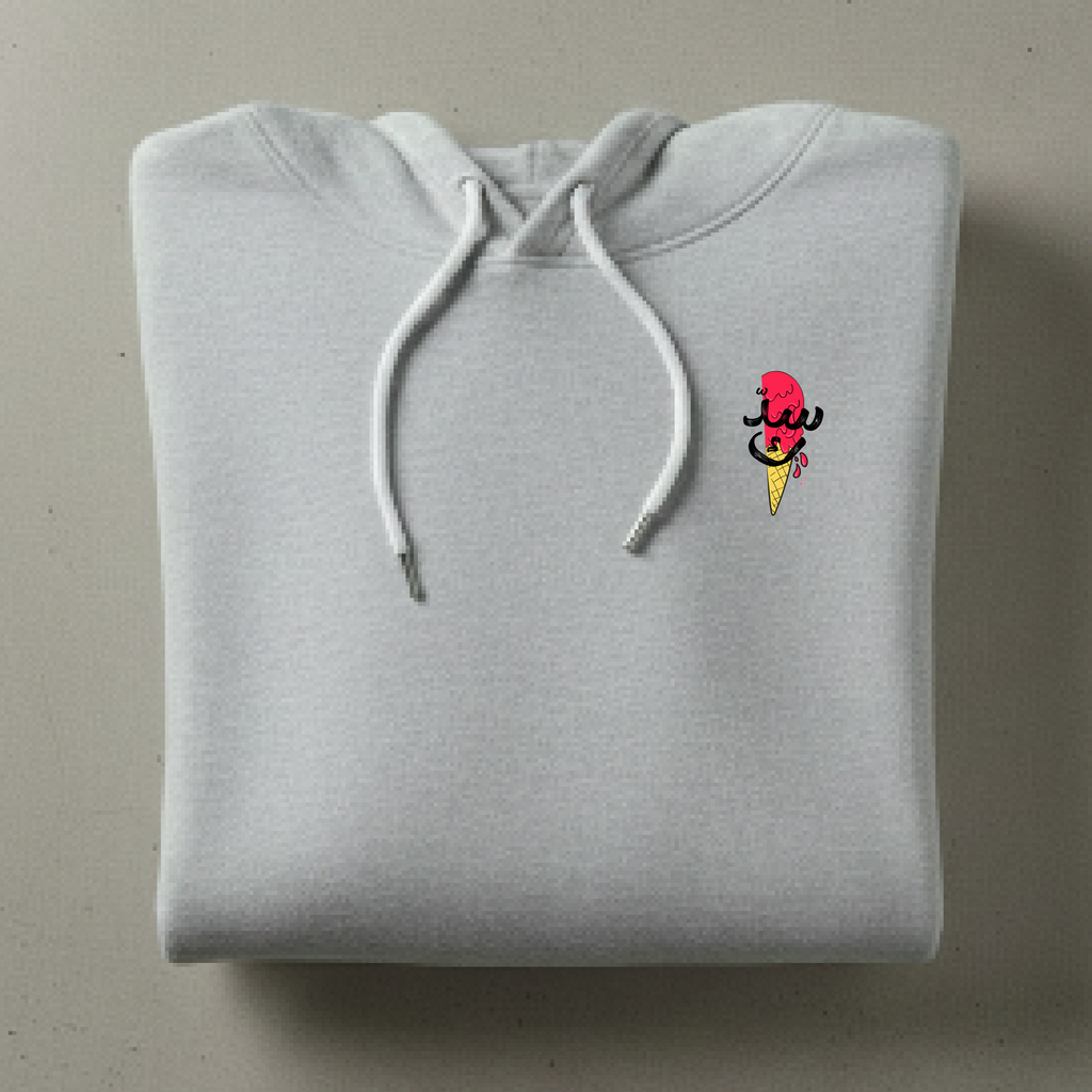 Folded gray hoodie with a small colorful logo on a beige background