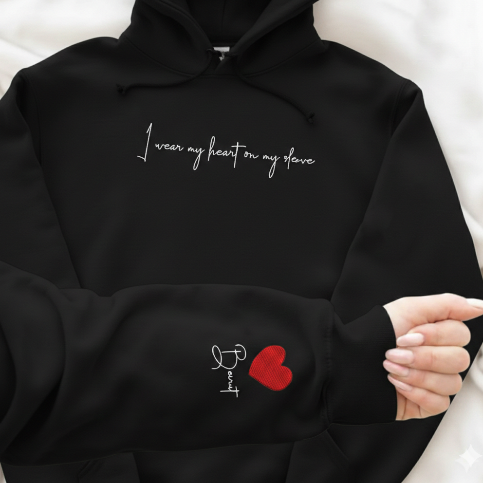 Black hoodie with embroidered heart  design on the sleeve