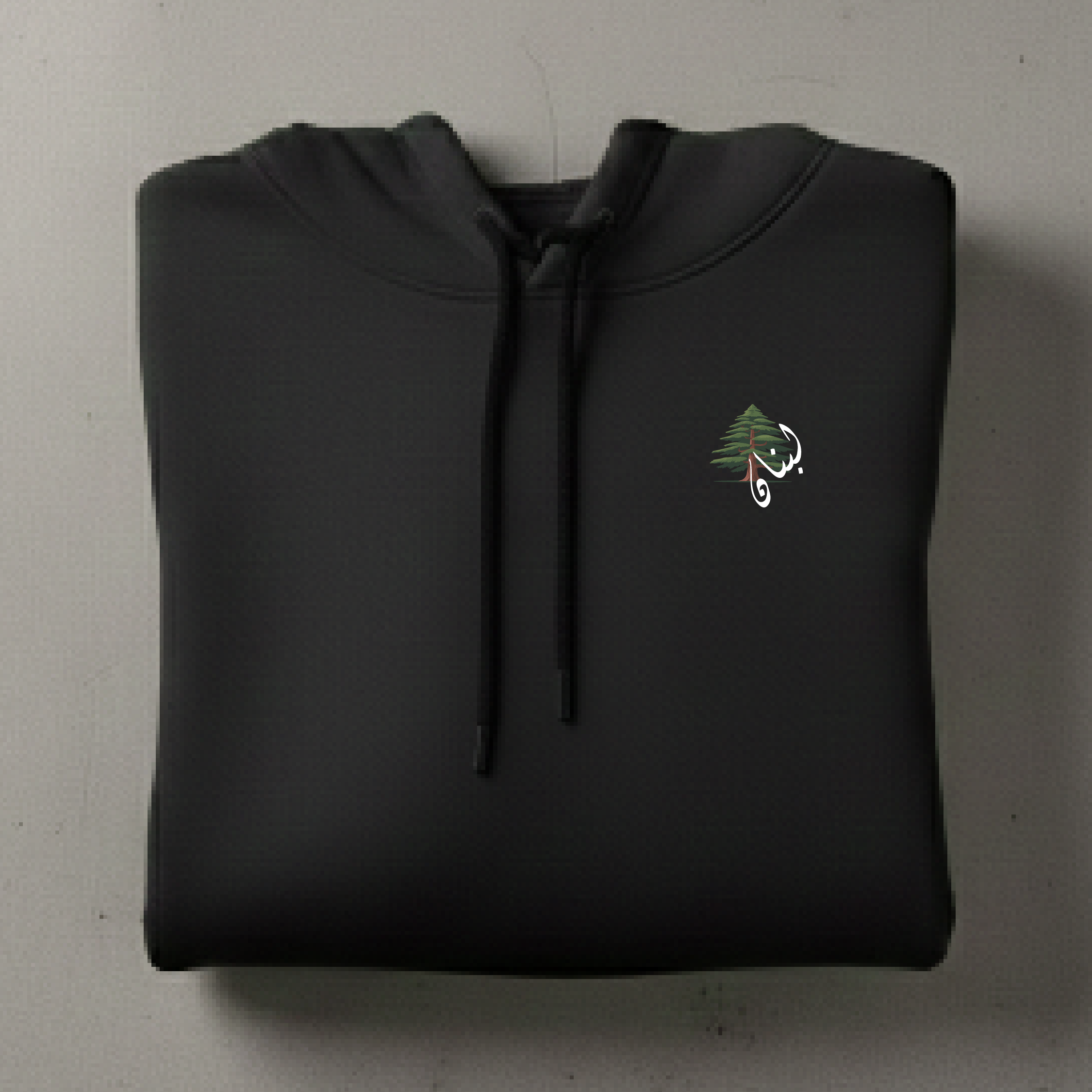 Black hoodie with a small printed cedar tree 